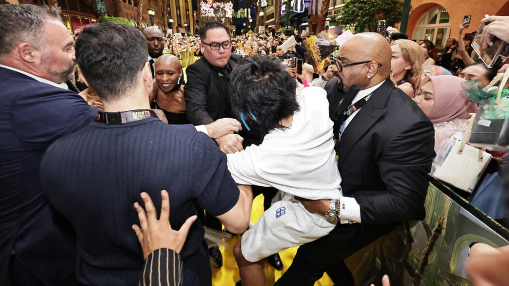 Australian man Johnson Wen jailed for intruding on Ariana Grande at Universal Studios Singapore premiere; security intervened to protect the pop star.